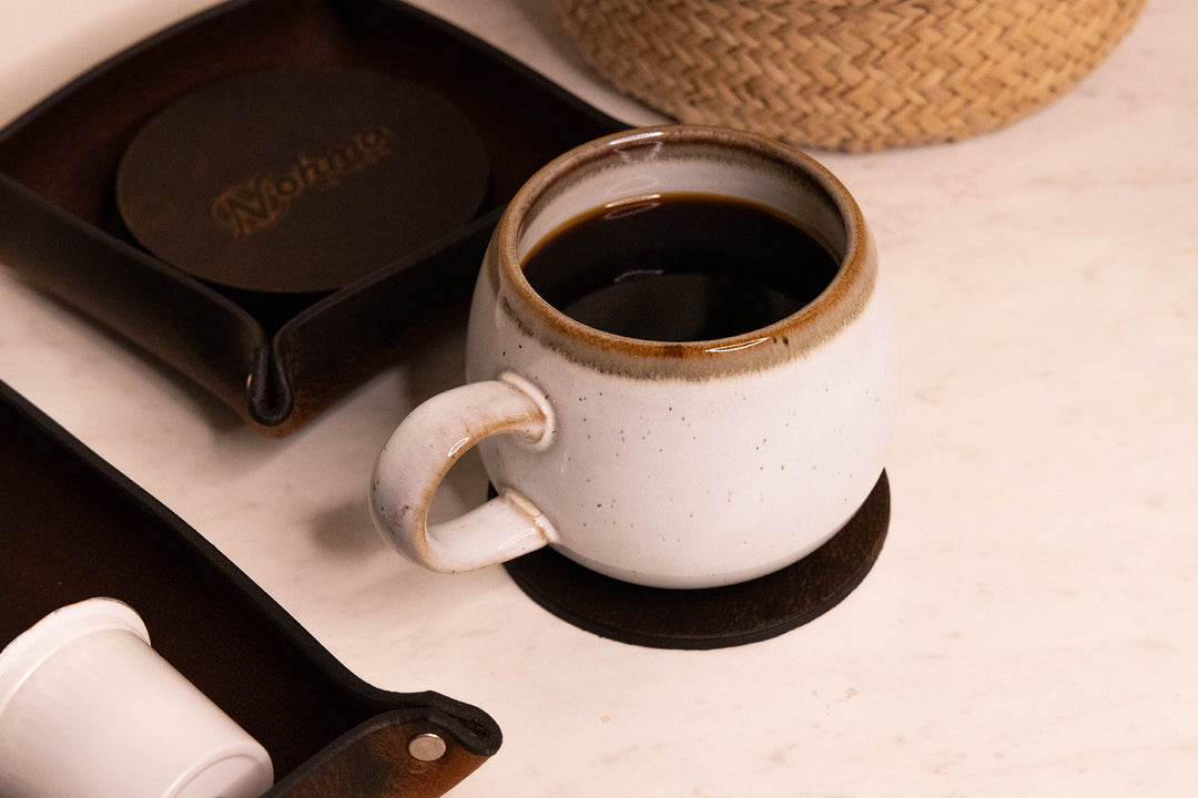 Vintage Brown Round Leather Coaster Set Display with coffee and Tray