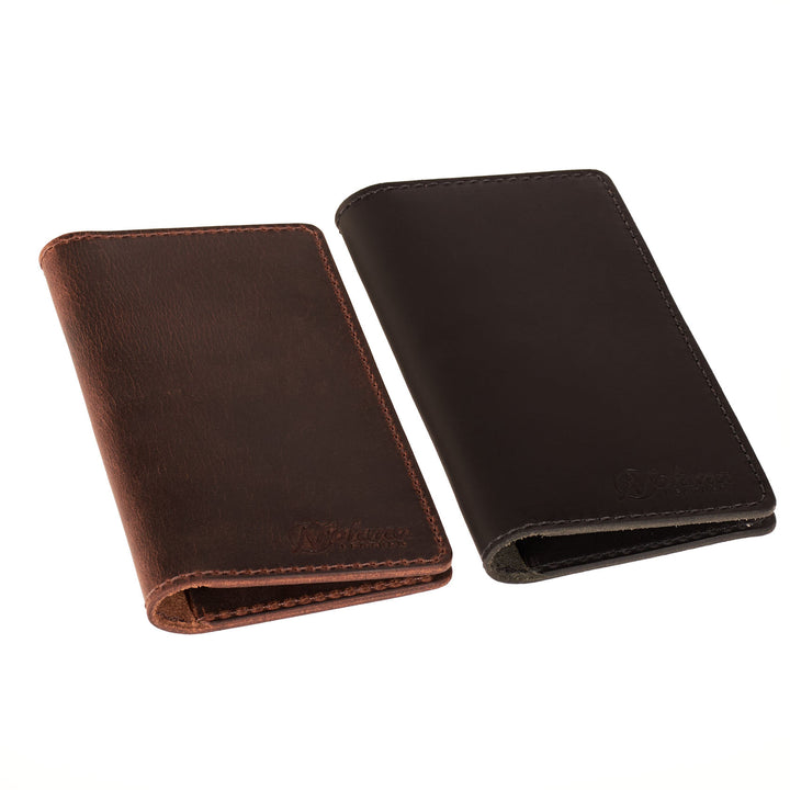 Two leather checkbook covers, one brown and one black, on a white background.