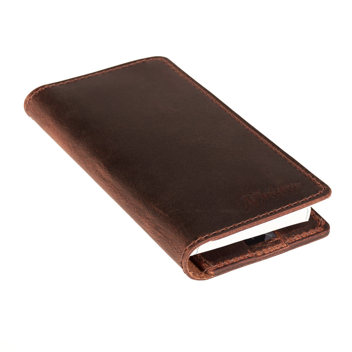 Brown leather checkbook cover on a white background