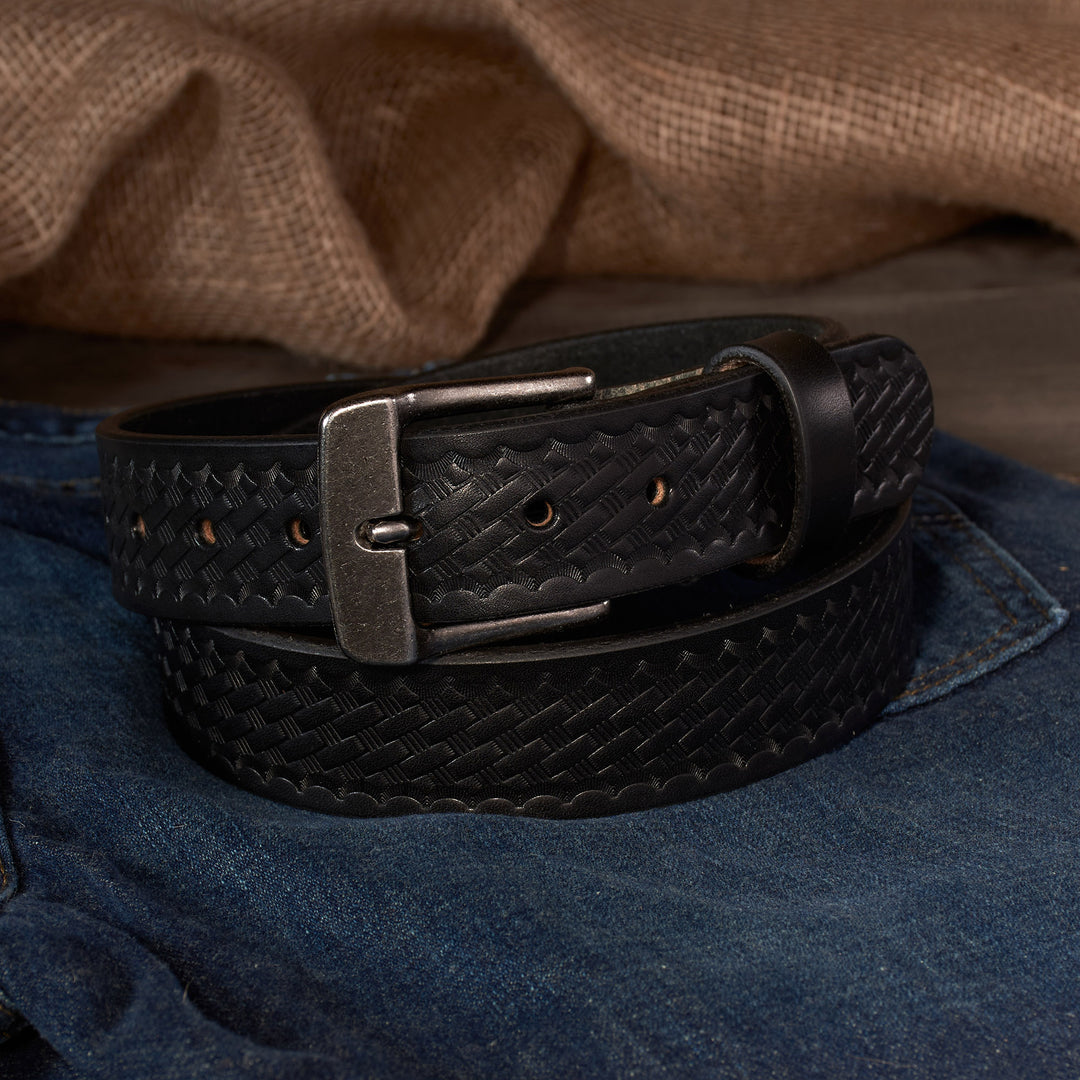 Black Basketweave leather belt with a silver buckle on a denim surface
