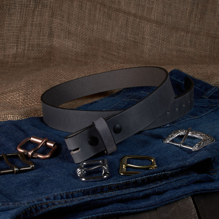 Gray leather belt with various metal buckles on a textured brown background