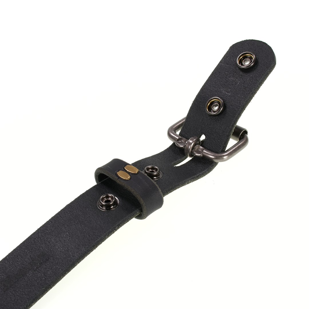 Black leather belt with metal buckle on a white background