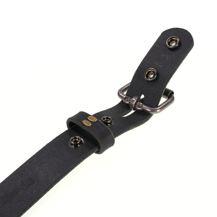 Black leather belt with metal buckle on a white background