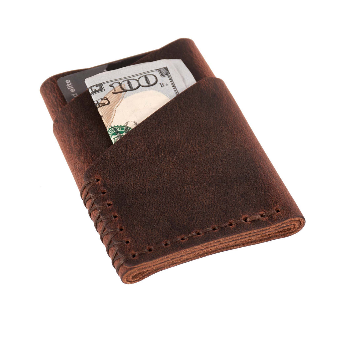 Brown leather wallet with money sticking out on a white background