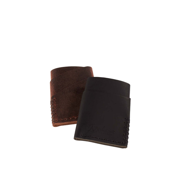 Two leather wallets, one brown and one black, on a white background
